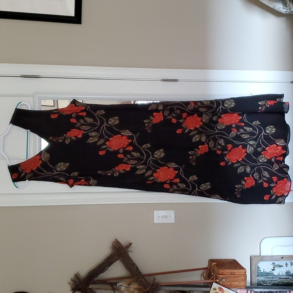 Megan Lee maxi dress with beading on the front.